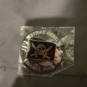 Strike Gently Enamel Pin with Skull Design